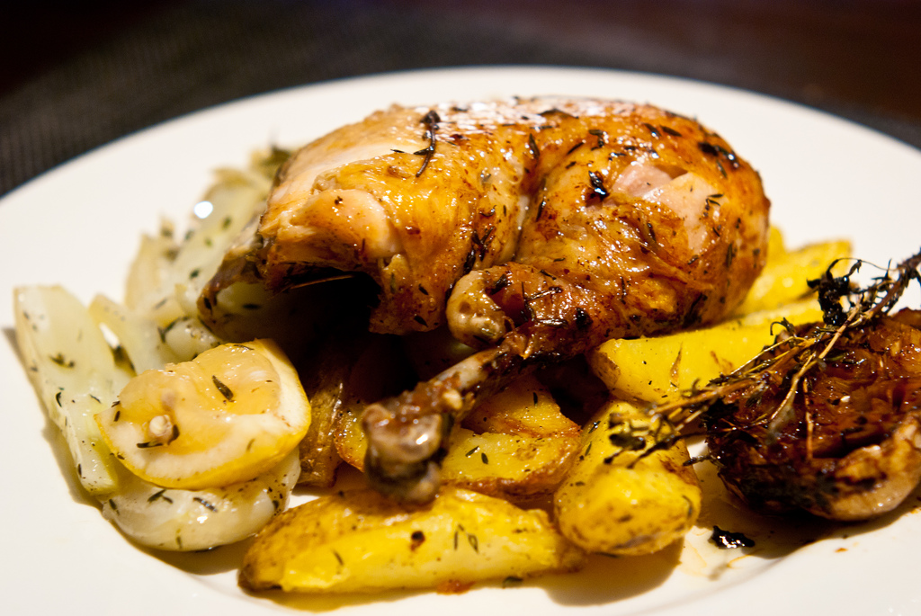 Roasted guinea fowl with garlic, lemon, fennel and potatoes.