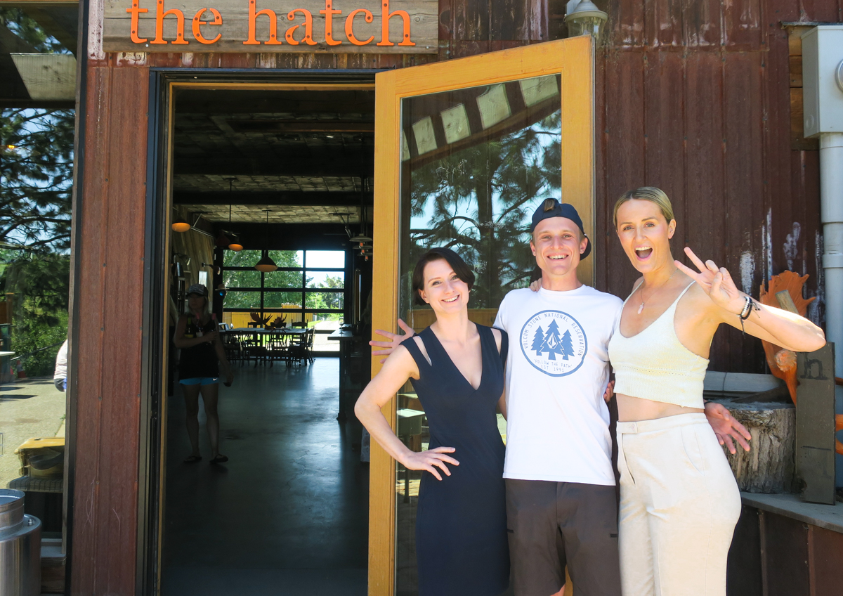 Laura, Johnny and Madeline Puckette pose outside of The Hatch, a negotiant-style winery in East Kelowna, BC By Wine Folly